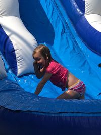 Smiling girl playing at water park