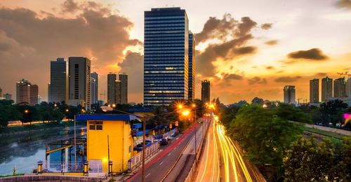 Illuminated cityscape at sunset