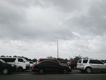 Cars on road against sky