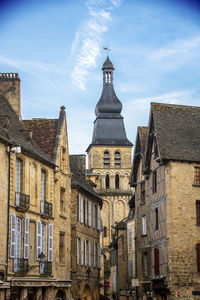 Buildings in city against sky