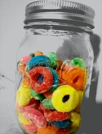 Close-up of colorful candies in glass container