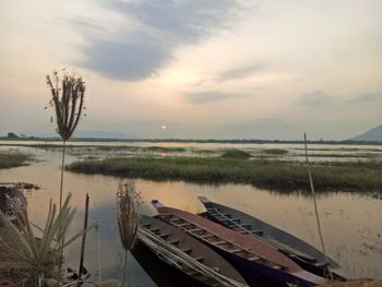 Scenic view of lake against sky during sunset