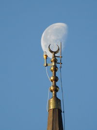 Low angle view of lighting equipment against clear sky