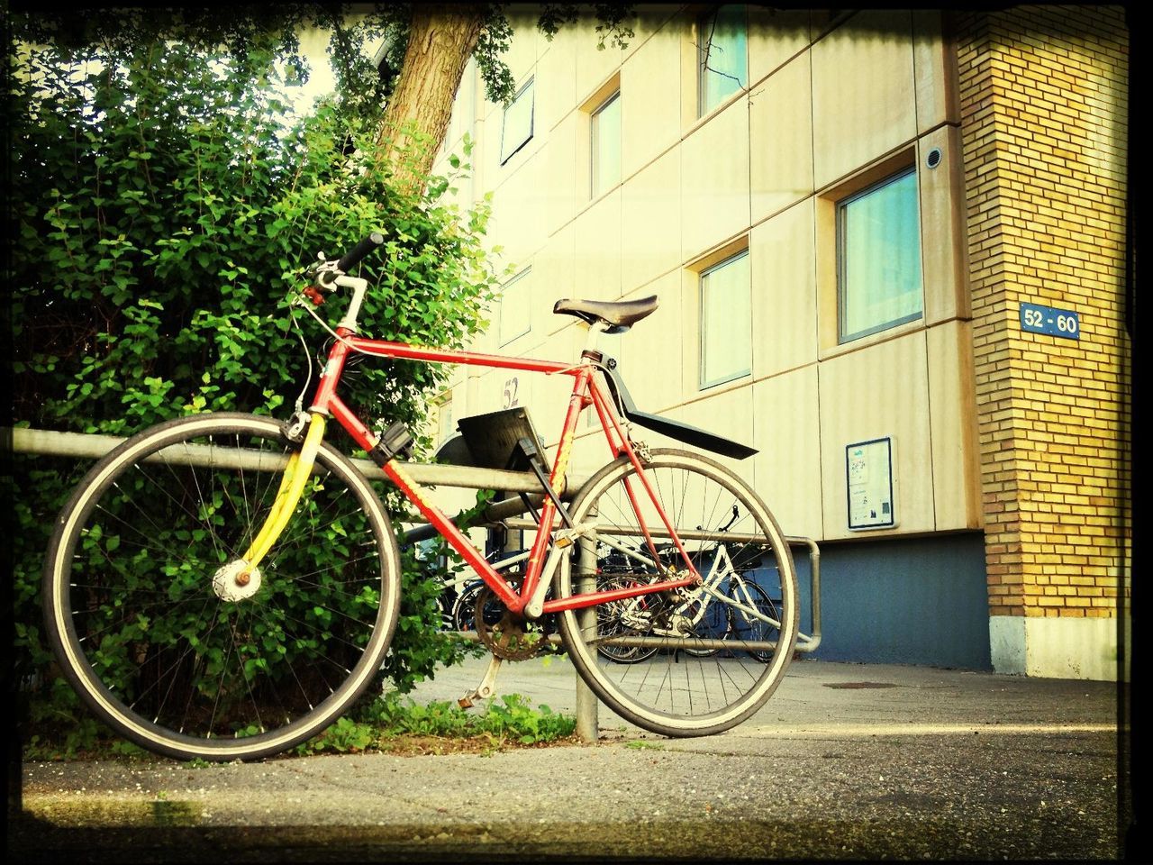 bicycle, building exterior, architecture, mode of transport, built structure, transportation, land vehicle, stationary, parked, parking, house, tree, transfer print, auto post production filter, street, day, window, residential building, residential structure, outdoors