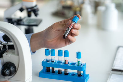 Cropped hand of scientist working in laboratory