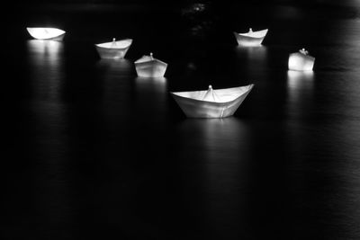 Close-up of illuminated lamp on table