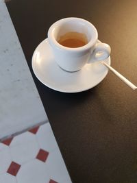 High angle view of coffee cup on table