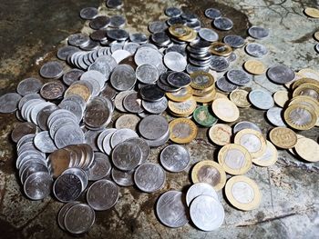 High angle view of coins on floor