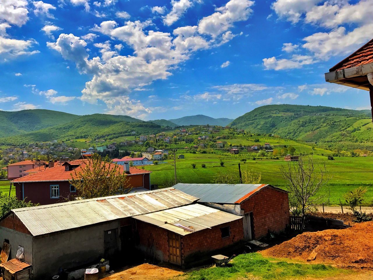 sky, mountain, day, cloud - sky, no people, architecture, outdoors, nature, landscape, roof, beauty in nature, built structure, building exterior, scenics, mountain range, tree