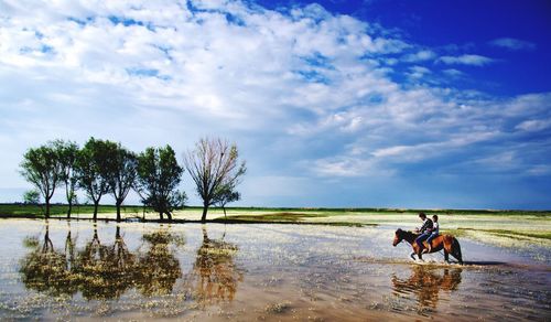 People riding horse