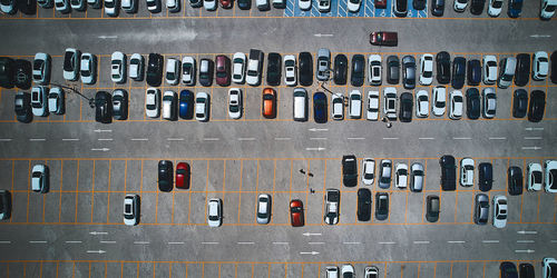 Parking lot. parked vehicles. aerial view of cars parked on outdoor asphalt parking lot