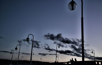 Low angle view of floodlight against sky