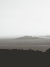 Scenic view of silhouette mountains against sky