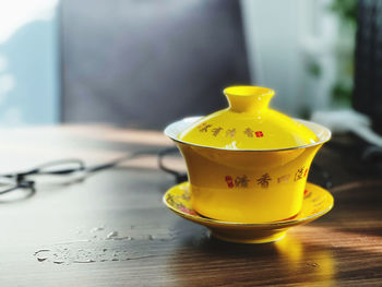 Close-up of yellow and coffee on table