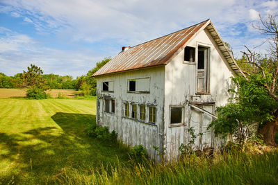 House on field against sky