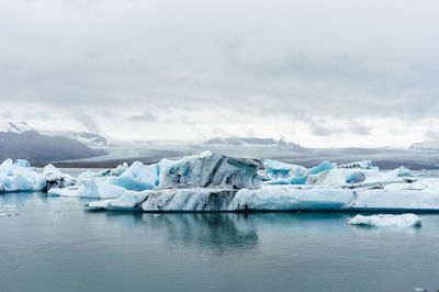 Scenic view of frozen lake against sky