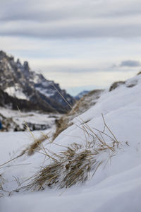 Scenic view of snow covered land against sky