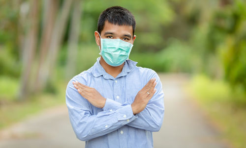 Portrait of young man standing outdoors