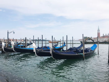 Boats in sea against sky