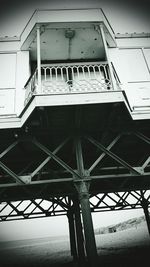 Low angle view of suspension bridge against sky