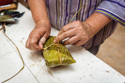 High angle view of woman preparing food on table