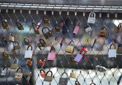 Close-up of padlocks on railing