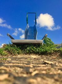 Built structure on field against blue sky