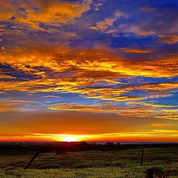 Scenic view of landscape against sky during sunset