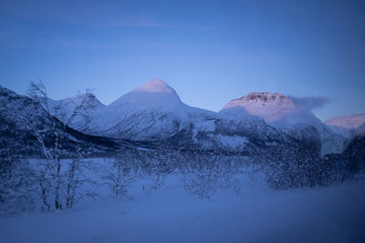 Norwegian winter landscape with snow-covered mountains. panoramic view.