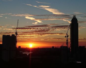 Silhouette of cityscape at sunset