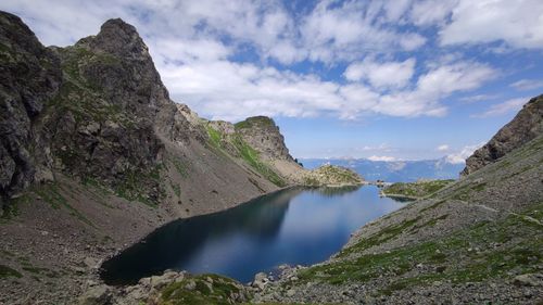 Scenic view of rocks and mountains against sky