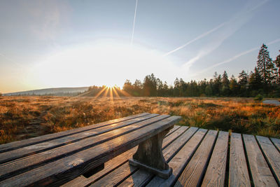 Scenic view of landscape against bright sun