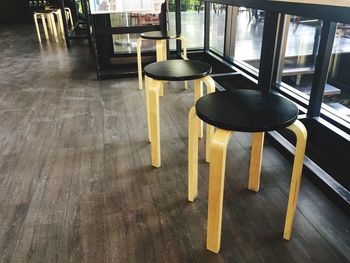 High angle view of empty chairs and table in restaurant