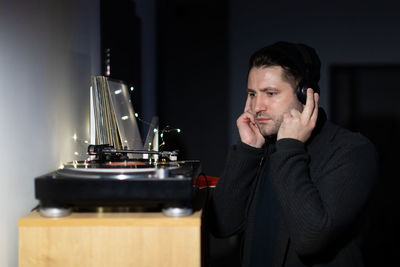 Portrait of young man wearing headphones