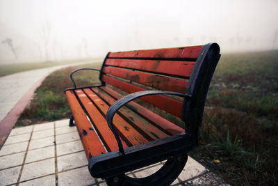 Close-up of empty seat on landscape