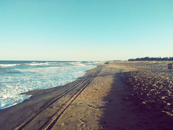 Scenic view of sea against clear blue sky