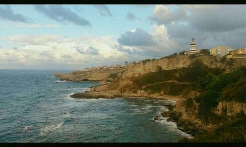 Scenic view of sea against cloudy sky