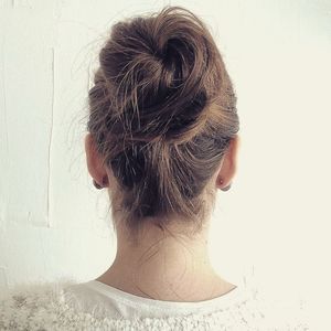 Rear view of a woman with hair bun