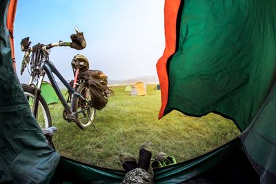 Panoramic view of bicycle on field against sky