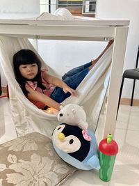 Cute girl with toy toys at home