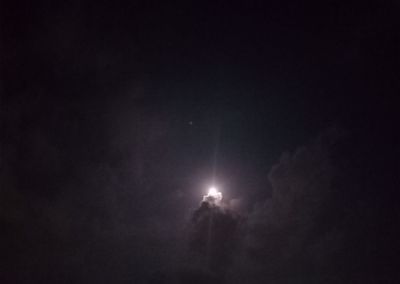 Low angle view of moon in sky at night