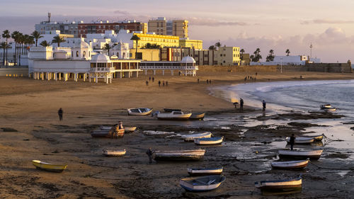 High angle view of beach and buildings against sky