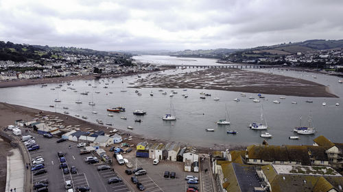 High angle view of city by sea against sky