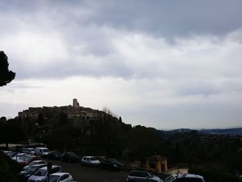 Cars on city against sky