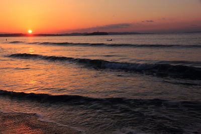 Scenic view of sea against sky during sunset