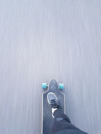 Low section of person on skateboard