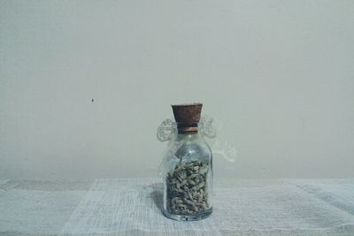 Close-up of buds in jar on table