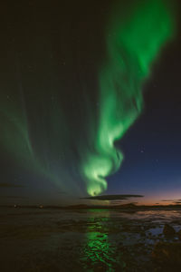 Scenic view of river against sky at night