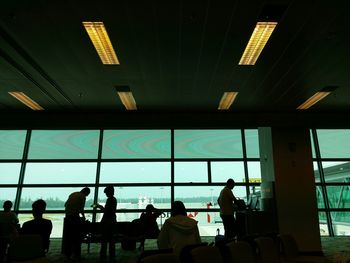 Silhouette people in office building