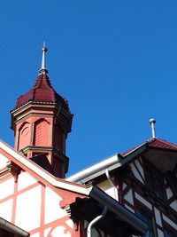 Low angle view of built structure against clear blue sky